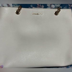 white and gold multi slot micheal kors bag